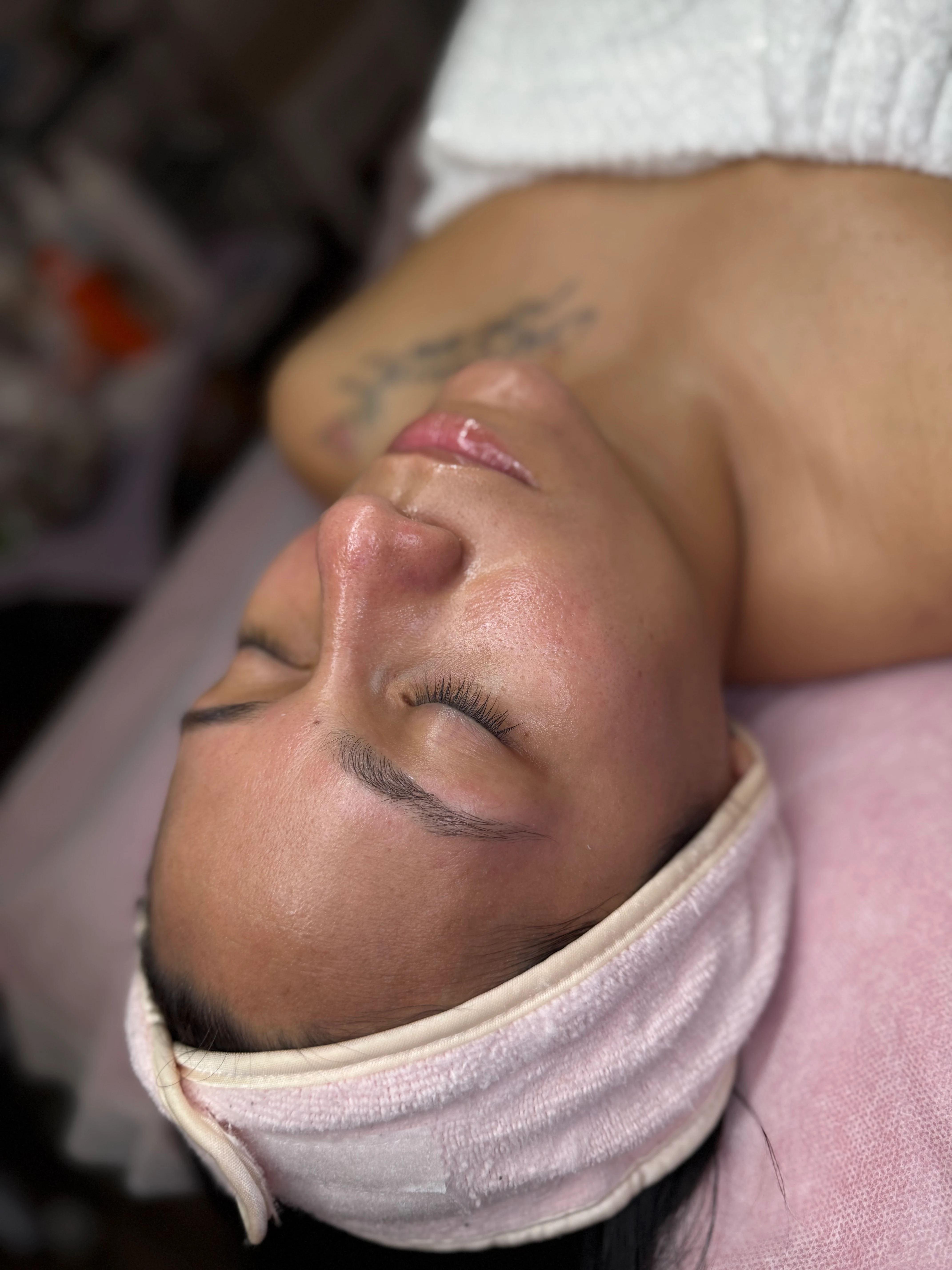 Facial treatment, overhead view in warm directional light